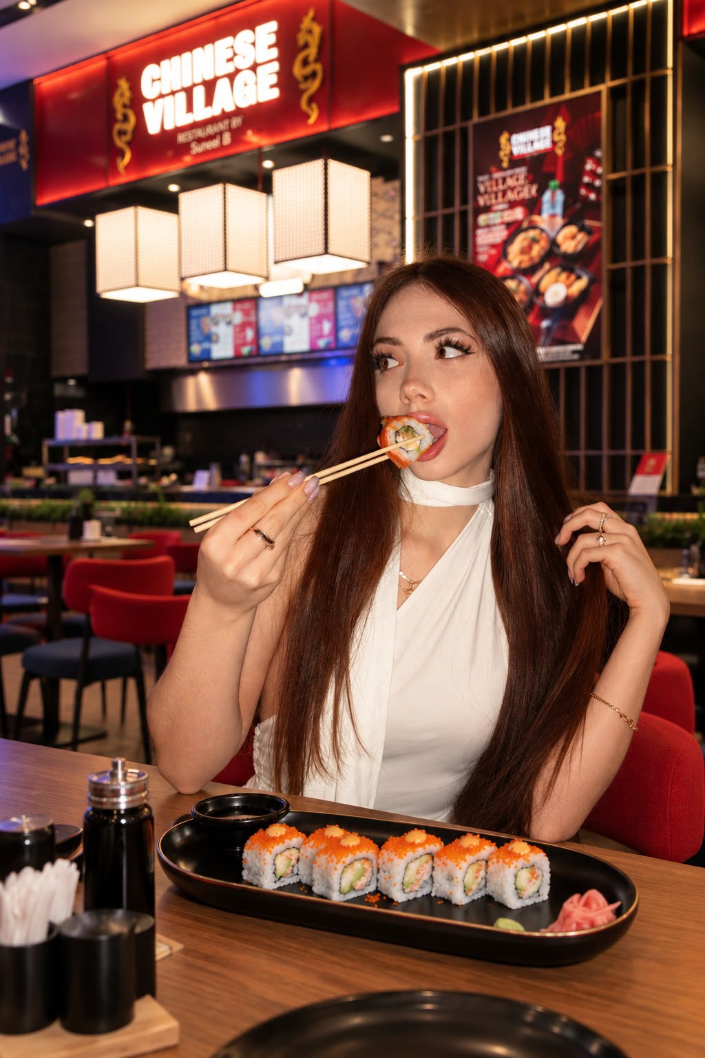 Guest enjoying sushi at Chinese Village